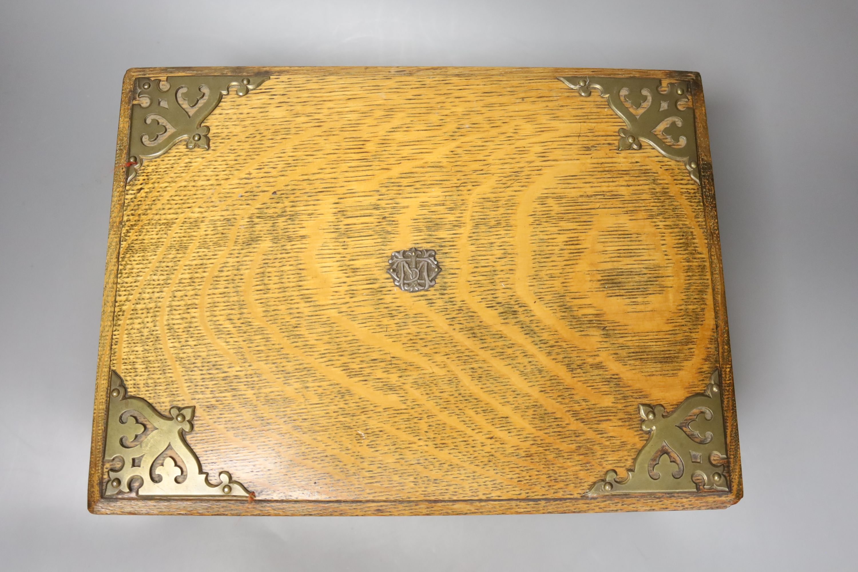 An oak games compendium with plated mounts and contents, 14 x 30cm